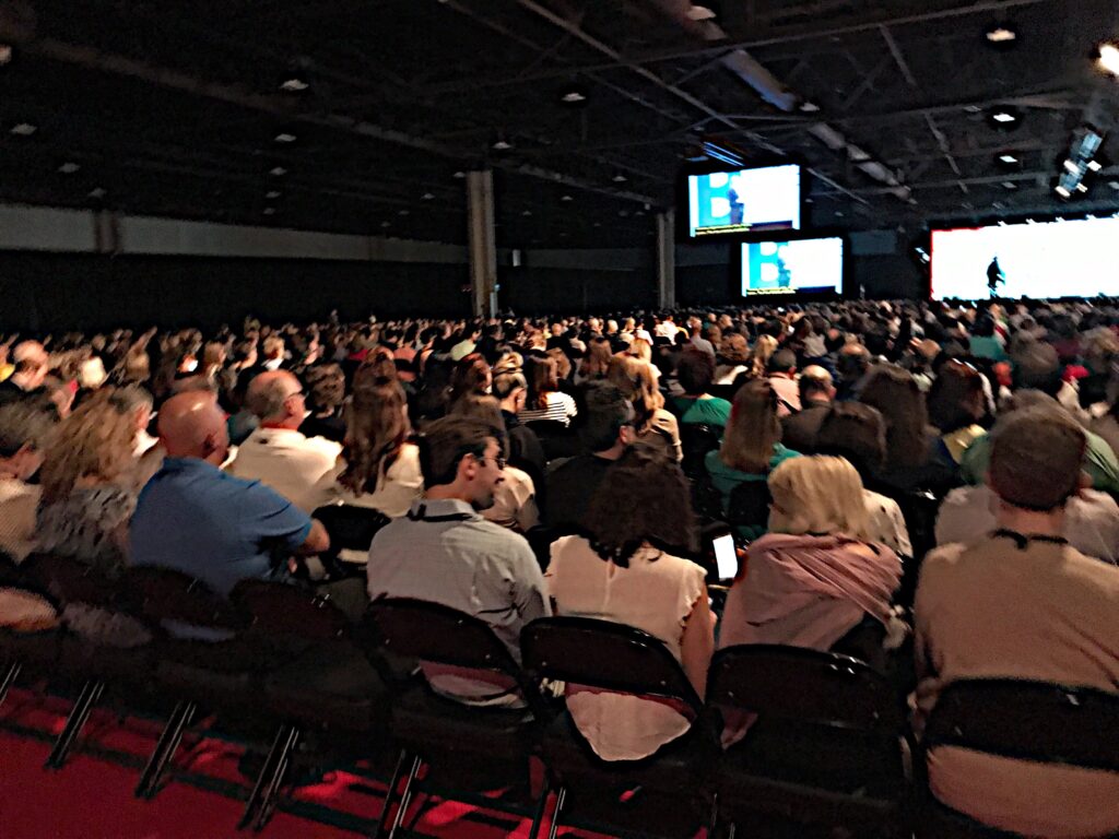 Large audience crowd gathering at a conference wat