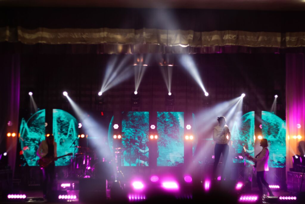 Music band on the stage bands silhouettes on a co